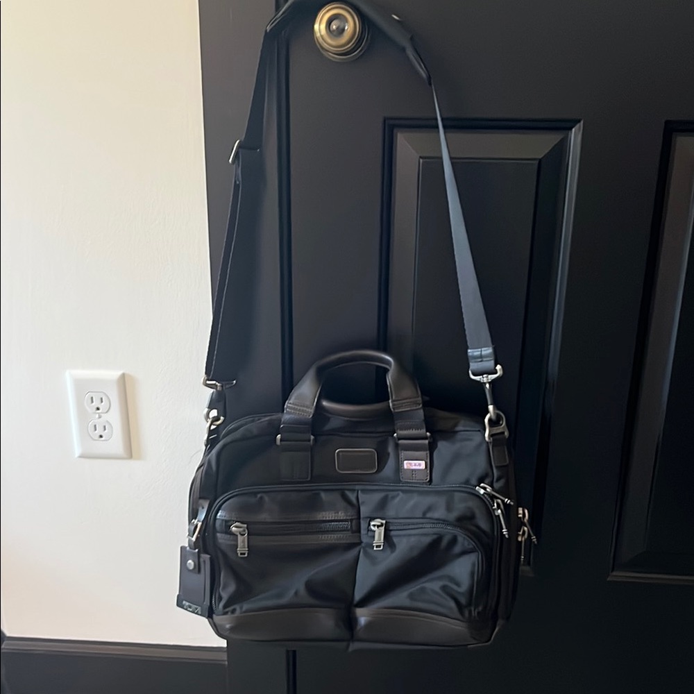 Tumi Black Messenger Bag with Durable Design